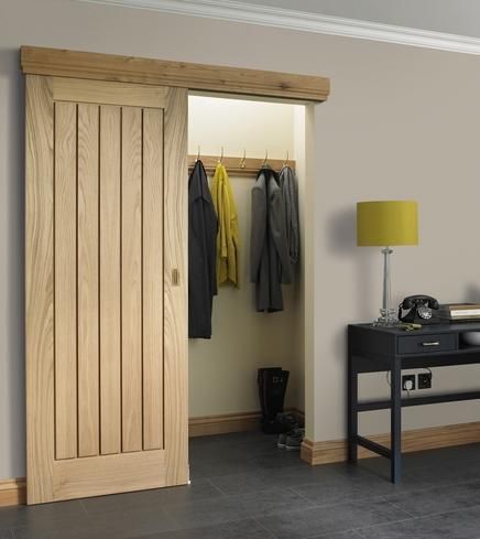 FULL Dordogne Oak - Howdens (as a sliding door) Pram Storage Hallway, Hidden Coat Storage, Coat Cupboard Ideas, Cloakroom Ideas Coats, Cloakroom Cupboard, Cloakroom Entrance, Entrance Storage, Coat Room, Coat Cupboard