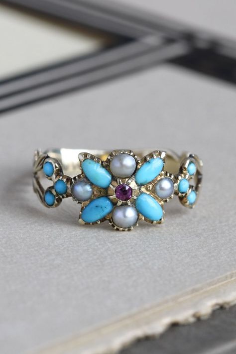 georgian ring circa 1820 in 14k set with turquoise and pearls in a flower custer design with a ruby in the center Regency Ring, Pearl Flower Ring, Ruby Flower, Georgian Ring, Georgian Jewelry, Blue Accent, Regency Era, Ring Antique, Pearl Flower