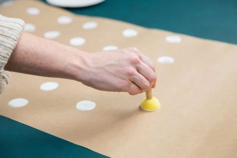 5 DIY Holiday Table Runners | How to Dress Up Your Holiday Table With Paper | HGTV White Table Cloth Brown Paper Runner, Paper Table Cloth Ideas, Brown Paper Table Runner Wedding, Brown Paper Runner, Diy Christmas Table Runner, Brown Paper Table Runner, Kraft Paper Tablecloth, Paper Table Runner Wedding, Craft Paper Table Runner