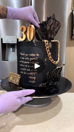 2.2K views · 99 reactions | Black and gold 30th birthday cake! #cakedecorating #30thbirthday #90sbaby  #cakevideo #c | Black and gold 30th birthday cake! #cakedecorating #30thbirthday #90sbaby  #cakevideo #c | By JV OM | This customer requested a cake
for her boyfriend's 30th birthday which I was super
happy to make because I also turned 30 this month. She told
me a few things that he likes but ultimately gave me creative
control. She knew that she wanted it to be a black and
gold cake. She mentioned he loves Oreos and he's really big
on nineties hip hop. She also gave me a Nipsey Hustle quote
that she wanted to include somewhere on the cake. And the
last thing she told me was make it elegant but dope. I knew
exactly where I wanted to go with this cake. So I started
out with a black butter Hip Hop Birthday Cake For Men, Mens 40th Birthday Cake, Gold 30th Birthday Cake, Men Birthday Cakes, 30th Birthday Cakes For Men, 40th Birthday Cakes For Men, Gold 30th Birthday, Black And Gold Cake, 30th Birthday Cake