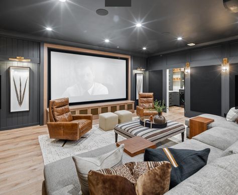 Basement Play Area And Family Room, Contemporary Movie Room, Movie Room And Playroom, Media Room Dark Walls, Basement Ideas With Projector, Projector Screen Basement, Modern Rec Room Ideas, Movie And Playroom, Family Room Tv Above Fireplace