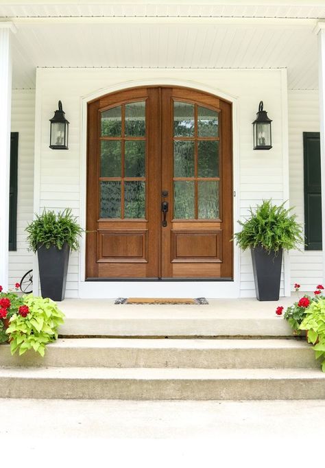 I’ve always been a big admirer of beautiful statement front doors. There’s something about pulling up to a home that has an eye-catching door that sets the tone for the whole house.  This post is in collaboration with Doors4Home. All thoughts and opinions remain my own.  One of the things that drew us to this house was the amazing wrap around porch. I envisioned myself sitting out here rocking my babies while catching the sunset. I feel incredibly blessed that I now get to Statement Entryway, Bi Fold Doors, Arched Front Door, Double Front Entry Doors, Front Door Inspiration, Front Door Styles, Doors Modern, Double Front Doors, Wood Front Doors