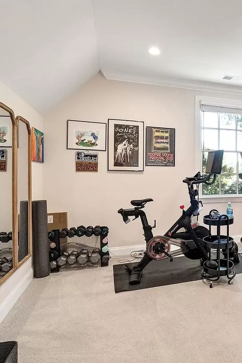 This bright and airy home gym has everything you need for a full-body workout at home. The space features a Peloton bike, a treadmill, a set of dumbbells, and a large mirror. The natural light and clean lines make the room feel inviting and energizing. #homegym #fitness #workout #exercise #treadmill #peloton #bike #dumbbells #mirror #interiordesign #homedecor #dreamhouse #furniture #room #roomdecor #roomrefresh #diseñodeinteriores #ideiasdedecoração Home Office Gym Combo, Office Gym Combo, Exercise Treadmill, Home Gym Design Luxury, Bright And Airy Home, Small Home Gym Ideas, Tv Set Up, Airy Home, Home Office/gym