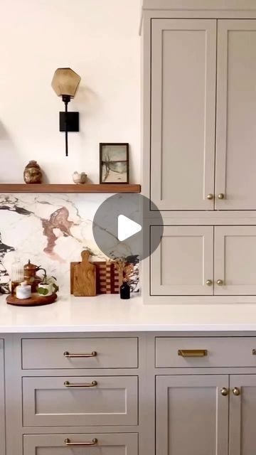 Virtual Interior Design • Setting For Four Interiors on Instagram: "Crushing on this ‘it’ mushroom cabinet color! Love this soft earthy hue paired with the gorgeous stone slab backsplash and brass hardware! Isn’t this color gorgeous?!
@kristinlaingdesign 

💫 Follow @settingforfour  for more interior inspiration and design ideas 💫
.
.
.
. 
#kitchen #kitchendesign #kitcheninspo #kitchendesignideas #kitchenisland
#kitchenremodel  #kitchencabinets 
#howwedwell #homeimprovements #CurrentDesignSituation #interiorlovers #interior_and_living #FindItStyleIt #lightandbright #InMyDomaine #MyDomaine #SMMakeLifeBeautiful #bhghome #homesohard #hgtv #amberinteriorsaintgotnothinonme" Mushroom Cabinet Color, Mushroom Cabinets Kitchens, Mushroom Kitchen Cabinets, Mushroom Cabinets, Slab Backsplash, Cabinet Color, Cabinets Kitchen, Cabinet Colors, House Renovation