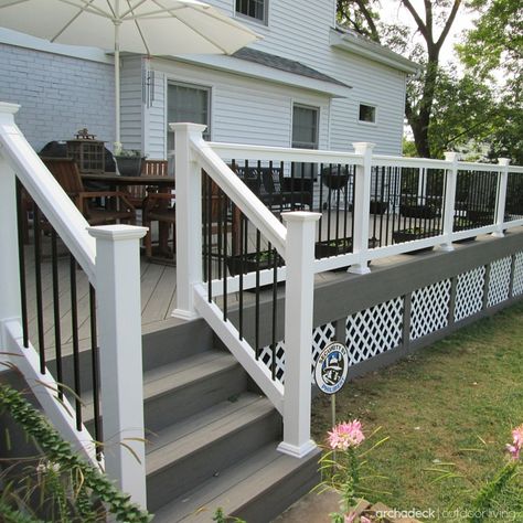 Slightly raised above grade-level, this deck design includes low maintenance TimberTech gray decking, white rails with black metal balusters, diagonal floor board pattern, and lattice under deck trim. Custom deck project in St. Louis by Archadeck | houzz.com Deck Skirting, Deck Railing Ideas, Deck Colors, Railing Ideas, Building A Porch, Patio Deck Designs, Deck Projects, Deck Railing, Porch Railing