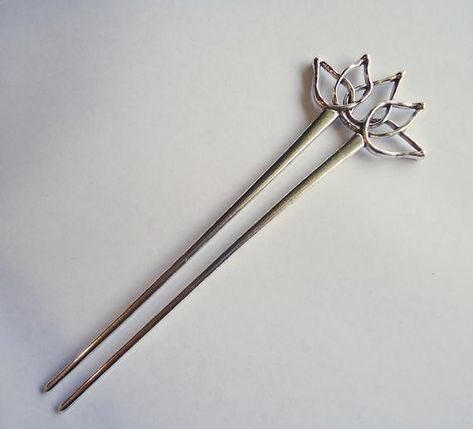 This decorative Silver Lotus Flower is approximately 1 7/8" Wide and 1" Tall.  It sits upon parallel hair sticks that are approximately 4.75" Long.  The total length is 5.75" Long.  The open lotus flower design lends itself to easily add dangles or embellishments of your choice!This listing is for ONE hair stick. Hair Stick Design, Open Lotus Flower, Japanese Hair Stick, Asian Hair Accessories, Clothing Pattern Design, Chopstick Hair, Silver Hair Pin, Lotus Flower Design, Hair Fork