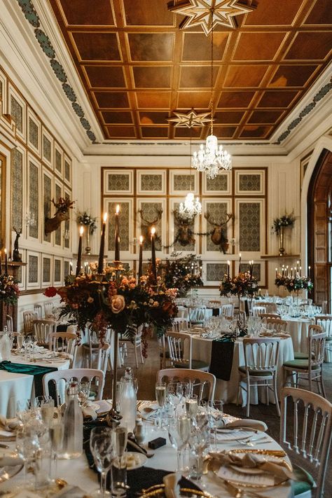 Drumtochty Castle wedding venue with gold tocuhes including cutlery, chandeliers and black candles on tall pink and red flower centrpiece Autumn Wedding Scotland, Allerton Castle Wedding, Drumtochty Castle Wedding, Wedding Cake With Gold Flakes, Cake With Gold Flakes, Drumtochty Castle, Tall Flower Centerpieces, Wedding Cake With Gold, Flower Centrepieces