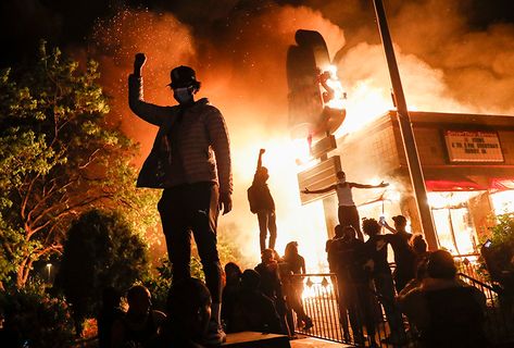 A proper understanding of urban rebellion depends on our ability to interpret it not as a wave of criminality, but as political violence. A Fire, A Group, A Man, Building, Twitter