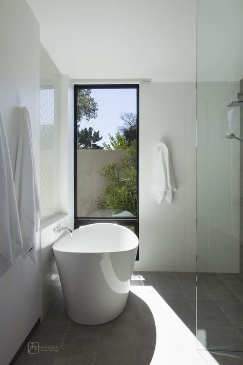 Open bath, tub area in a modern home in Ojai, CA, by Maraya Interior Design.  Tub and shower share the same space, with a 'baja' shower style.  Porcelain floor tiles, freestanding modern tub, white niche.  #freestandingtub, #moderntub, #contemporarybath, #modernbath, Bathroom Freestanding Tub Shower Combo, Bath By Window, Open Shower Next To Bath, Bath Tub And Shower Combo Ideas, Bath With View Window, Freestanding Bathtub In Front Of Window, Tub With Big Window, Shower And Tub Side By Side, Bathtub Big Window