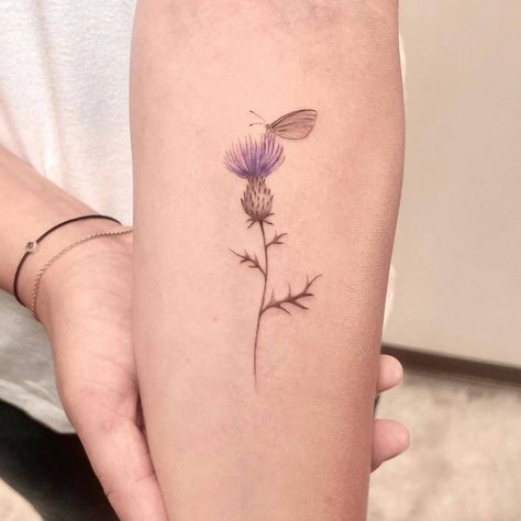 Fine line thistle flower tattoo on the inner forearm. Thistle Ankle Tattoo, Thistle And Lavender Tattoo, Fineline Thistle Tattoo, Delicate Thistle Tattoo, Scotland Thistle Tattoo, Scottish Thistle Tattoo Simple, Scottish Thistle Tattoo Delicate, Fine Line Thistle Tattoo, Scottish Tattoos For Women