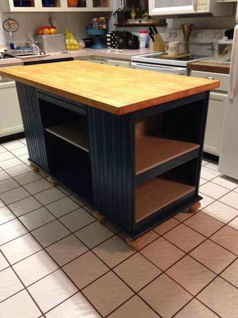 after spending countless hours surfing the web for the perfect kitchen island with a very small budget, left me with very little to choose from. So I decided to make my own and off I went to hit all the second hand stores. SCORE!! Found an old solid wood desk and also butcher block table top. Purchased both for $70. Removed the top of the desk and moved it to the bottom for a platform for the island, attached the butcher block top and added bun feet to bring the island to counte… Diy Concrete Counter, Faux Brick Backsplash, Butcher Block Table, Faux Brick Panels, Old Cabinet Doors, Reclaimed Wood Desk, Butcher Block Top, Rustic Kitchen Island, Space Kitchen