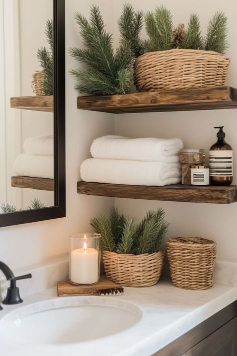 A woven basket filled with pine twigs and a few scattered pinecones is the easiest rustic touch. I love how this simple Christmas bathroom decor idea brings nature indoors. It’s low-maintenance but still festive! How would you style this in your space? Christmas Bathroom Decor Ideas, Bathroom Shelf Decor, Christmas Bathroom Decor, Table Decor Living Room, Christmas Bathroom, Bathroom Design Decor, Bathroom Decor Ideas, Western Homes, Bathroom Update