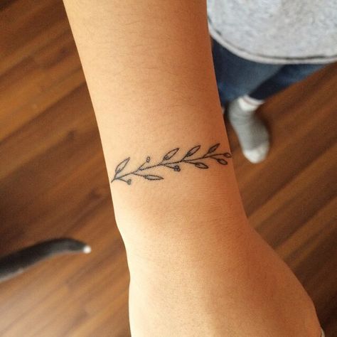 fern Branch Bracelet Tattoo, Exhale Tattoo, Inhale Exhale Tattoo, Expecto Patronum Tattoo, Olivia Harrison, Wrist Bracelet Tattoo, Small Sister Tattoos, Olive Branch Tattoo, Branch Bracelet