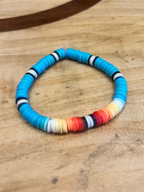 This super cute beaded bracelet is inspired by sunsets in a western desert! This style is sure to add a pop of color to any outfit! Western Heishi Bracelet, Clay Beads Jewelry Ideas, Clay Bead Inspiration, Western Clay Bead Bracelet, Western Beaded Bracelets, Country Bracelets, Western Beaded Jewelry, Diy Western Jewelry, Bracket Ideas