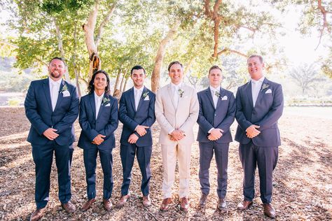 Tan Groom Navy Groomsmen, Groom In Tan Groomsmen In Navy, Beige Groom Navy Groomsmen, Groom Tan Suit Groomsmen Navy, Navy And Tan Groomsmen, Navy Blue And Tan Groomsmen Suits, Tan Suit For Groom, Tan And Blue Groomsmen Attire, Blue And Tan Groomsmen