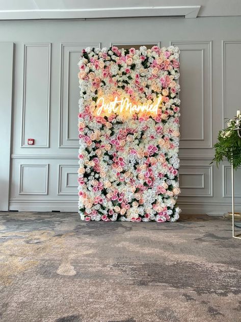 Our half Flower wall with full punch and 'Just Married' neon sign. A Floral backdrop creating a focal point in a luxury style venue in Dublin, Ireland. Vibrant blossoms for summer through colorful accents. An Instagrammable backdrop Event decor for an Irish wedding. We specialise in Floral artistry by creating this handmade organic piece. Salon Photo Backdrop Wall, Sweet 16 Party Planning, Backdrop Event, Half Flower, Flower Wall Backdrop, Event Backdrop, Wedding Decor Style, Venue Wedding, Salon Interior Design