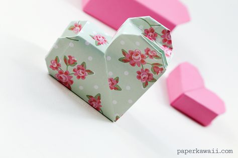 Learn how to make a pretty origami heart box! This origami box has a concealed lid, it would make the perfect gift box at Valentines or birthdays for a loved one. Hart Origami, Origami Heart Instructions, Envelope Origami, Origami Box With Lid, Valentines Origami, Pretty Origami, Box Origami, Paper Kawaii, Origami Paper Folding