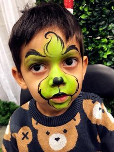 Kids Christmas Makeup, Face Paint Grinch, Boys Christmas Face Paint, Easy Face Painting Ideas For Kids Christmas, Winter Face Paint Ideas, Christmas Face Painting Easy Cheek Art, Grinch Face Makeup, Christmas Facepainting Ideas, Face Painting Christmas Easy