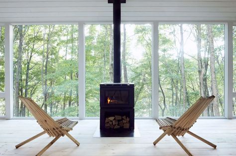 Hygge in Ohio: An Architect's Scandi-Inspired Off-the-Grid Hut - Remodelista Black Mosaic Tile, Shell Knob, White Mosaic Tiles, Family Cabin, Off Grid Cabin, Cedar Shingles, Pine Floors, Tiny Cabin, Forest Wallpaper