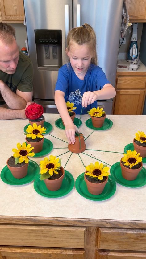 Don't pull the Wrong Flower 😂 | flower, entertainment, flowerpot | Don't pull the Wrong Flower 😂 Kids and family play fun spring table game with flower pots. Great outdoor game for spring. This video was produced by... | By Wonder and Raw | Facebook | Pull one. Pull one. Oh it's this one. This one right here. I'm sorry. Let's see. Let's see. There you go. Oh $10. Nice. $10. Nice. Your turn Kess. Pull a string. Pull one string. Oh it's that one. What it is? What is inside? What's inside? What c Reverse Raffle, Connect Group, Twister Game, Fest Ideas, Concentration Games, Flower Birthday Party, Flower Kids, Flower Games, Plant Games