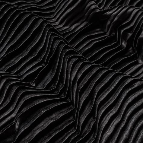 There's nothing shady about this Black Pleated Stretch Satin! Sporting a smooth and soft face, a modestly structured drape, and a fun accordion pleated design with a fair amount of stretch along the weft, it's ideal for A-line skirts, maxi skirts, empire dresses and more! Opaque in nature, a lining isn't needed but may be used in instances where additional structure is desired.  Please be aware that this collection of pleated fabrics is measured and cut with an open pleat. Brand Exploration, Mood Designer Fabrics, Pleated Fashion, Garment Sewing, Soft Face, Dress With Pleats, Black Drapes, Duchess Satin, Mood Fabrics