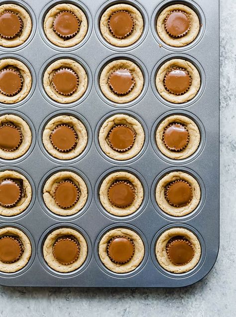 A mini muffin pan full of peanut butter cup cookies. Muffin Pan Desserts, Cup Cookies Recipe, Muffin Pan Recipes, Peanut Butter Blossoms Recipe, Brown Eyed Baker, Gluten Free Peanut Butter Cookies, Cup Cookies, Homemade Peanut Butter Cups, Vegan Peanut Butter Cookies