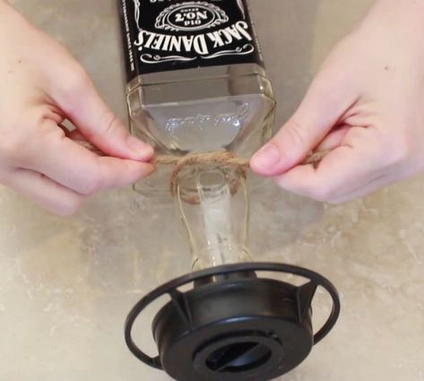 Easy DIY Upcycled Jack Daniel's Bird Feeder Wild Turkey Whiskey, Bottle Bird Feeder, Diy Hummingbird Feeder, Wine Bottle Bird Feeder, Jack Daniels Bottle, Diy Bird Feeder, Bottom Of The Bottle, Wine Bottle Diy, Jim Beam