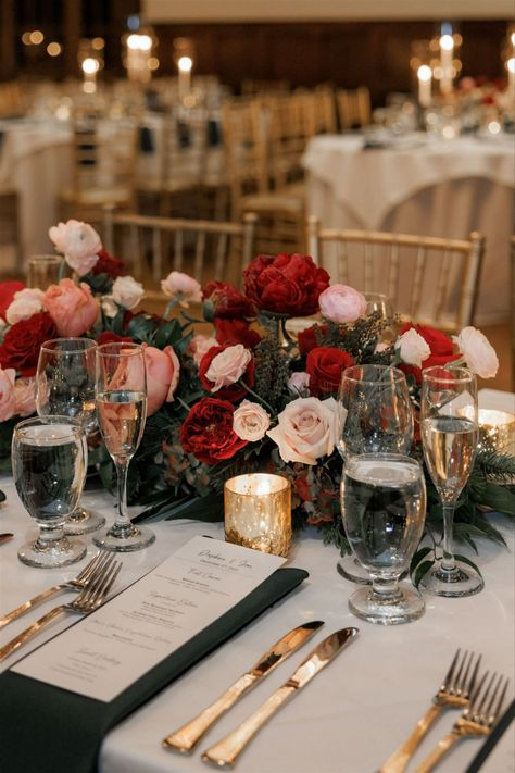 Oval table with lush florals and winter greens for the perfect December wedding centerpiece. PC Kseniya Berson Photography https://kseniyaberson.com/ Oval Table Decor Wedding, Red December Wedding, February Wedding Table Decor, Oval Table Centerpieces, Cathedral Wedding Ceremony, Head Table Wedding Decorations, Lush Christmas, Romantic Winter Wedding, Winter Greens