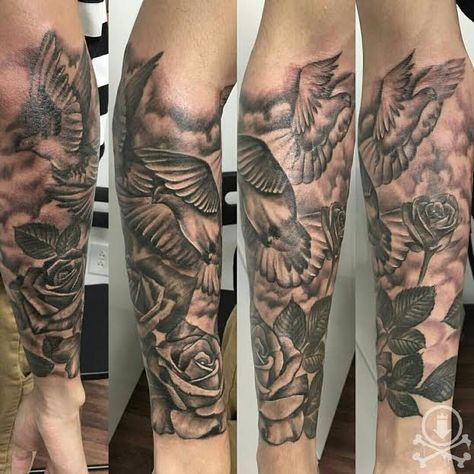 Lovely black and grey 3/4 sleeve tattoo featuring doves, roses, and clouds by Alex Feliciano.  #12ozstudios #team12oz #tattoos #tattooartist #tattoosformen #tattoosforwomen #blackandgrey #animaltattoos #dove #roses Roses And Doves Tattoo, Doves Tattoo, Cloud Tattoo Sleeve, Outer Forearm Tattoo, Dove Tattoos, Patriotic Tattoos, Girls With Sleeve Tattoos, Forarm Tattoos, Tattoo Inspiration Men