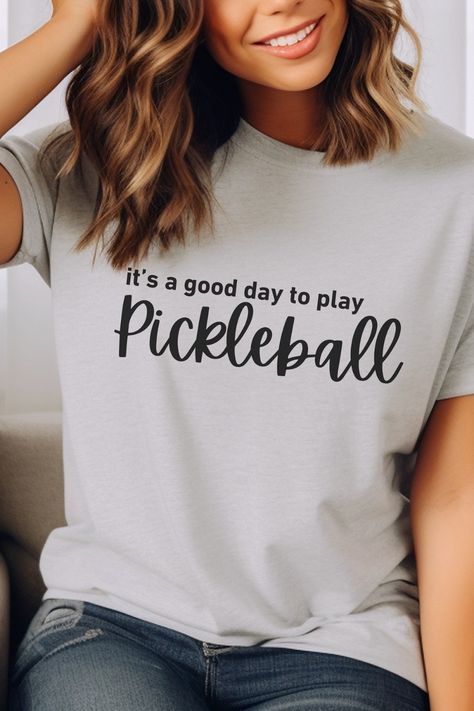 Athletic Heather Grey Bella Canvas tshirt. Shirt says it's a good day to play Pickleball in all black. It's a good day to play it all lower case on the first line in a traditional font. Pickleball is on the second line in a large cursive font. Ball Outfit Women, Pickle Ball Outfit, Pickleball Svg, Pickleball Tournament, Coach Svg, Pickleball Funny, Pickleball Tshirt, Ball Outfit, Pickleball Shirt