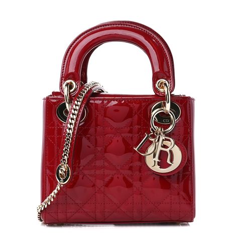 This is an authentic CHRISTIAN DIOR Patent Cannage Mini Lady Dior in Red. This petite handbag is crafted of geometric quilted patent leather in red. It features matching patent leather top handles, an optional shoulder strap and gold hardware. The top opens with an interior flap to a red Dior monogram jacquard interior with a zipper pocket. 1357406 Red Luxury Bag, Red Lady Dior, Dior Mini Bag, Christian Dior Runway, Lady Dior Mini, Mini Lady Dior, Dior Monogram, Bday Gift, Red Purses