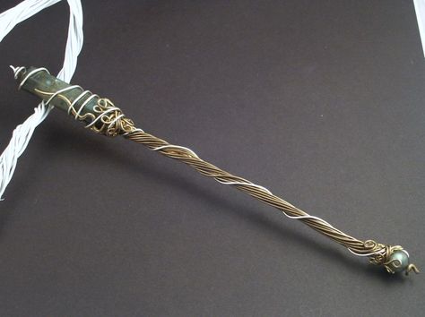 "Harry Potters Wand".  This is aged brass, labradorite, and fine silver. It measures about 9 inches long. Harry Potter's Wand, Crystal Wrapping, Copper Wire Art, Harry Potte, Harry Potter Jewelry, Theme Harry Potter, Wire Wrapped Jewelry Diy, Harry Potter Wand, Fairy Wands