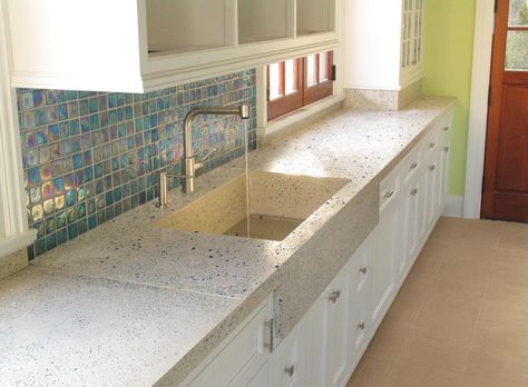 Beautiful kitchen with concrete counters and sink and abalone-esque tile back splash. Concrete Tiles Kitchen, Blue Kitchen Countertops, White Concrete Countertop, Diy Concrete Slab, Glass Kitchen Countertops, Concrete Countertop Ideas, Terrazzo Countertop, Blue Countertops, Terrazzo Kitchen