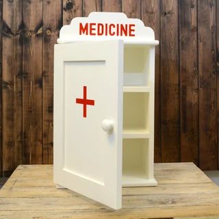 A traditional style medicine cabinet with two shelves Uni Decor, Antique Dresser With Mirror, Country Shelves, Quirky Kitchen Decor, Quirky Furniture, Nurse Decor, Quirky Bathroom, Cozy Loft, Doctors Office