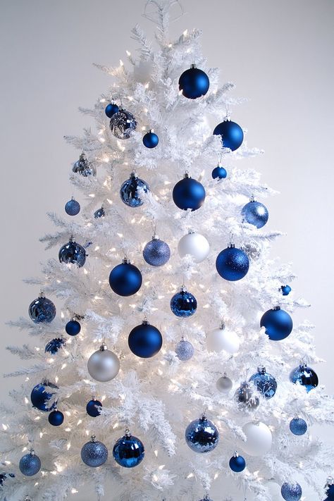 31 Magical Blue Christmas Tree Ideas That Go Beyond Basic Baubles Light Blue Christmas Tree Decorations, Dusty Blue Christmas, Navy Ornaments, Blue Christmas Aesthetic, Blue Christmas Tree Ideas, Navy Christmas Tree, White Holiday Decor, Turquoise Christmas Tree, Grey Christmas Tree