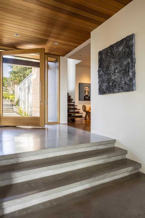 modern-lake-house-entry Sunken Foyer Entry, Modern House Entryway, Mid Century Modern Entrance Hall, Modern Wood Interior Doors, Hallway With Windows On One Side, Stairs Living Room, Modern House Entrance Interior, Entry Design Entrance, Long Entry Hallway