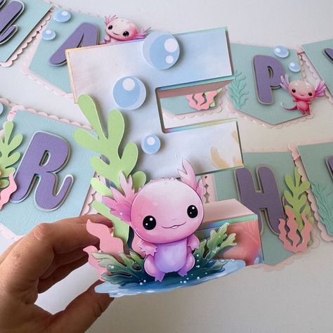 Beautiful Axolotl 3D letter. Perfect to decorate your table with the initial of the birthday child. Bring all the magic to your Axolotl Party or event.  DETAILS: *This listing is for 1 3d letter. If you need more than one please select it in quantity.  *This 3d letter is made in high quality CARDSTOCK PAPER (65-80LB)  *The size of the 3D letter is 8"  *All the images and details are placed on the letter with foam tape to give it a 3D look.  *There are two different designs on the pictures. Pleas Axolotl Party Decorations, Axolotl Birthday Party Decorations, Axolotl Birthday Party Ideas, Axolotl Party Ideas, Axolotl Birthday Party, Axolotl Party, Wooden Letter Ideas, Birthday Treat Bags, Cool Room Designs