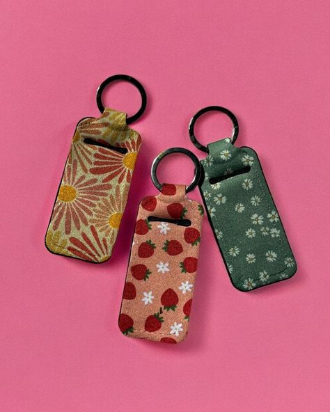 NEWWWW… Keep your lips moisturized on the go with our stylish sublimated chapstick holder keychains! 💄✨ Never lose your lip balm again! #ChapstickChic #OnTheGoEssentials #shopsmall #smallbusiness #boutique #shopping Chapstick Keychain, Car Deco, Chapstick Holder, Your Lips, Small Shop, Christmas List, Lip Balm, Keychains, The Go