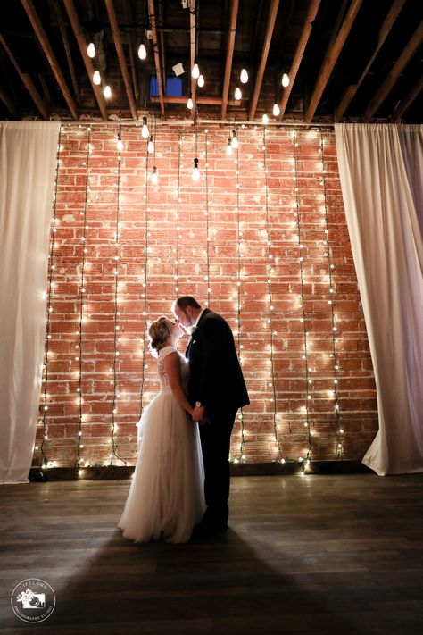 Gala Decorations, Brick Wall Backdrop, Reception Backdrop, Wedding Reception Backdrop, Light Brick, Photo Backdrop Wedding, Green Themed Wedding, String Lights Wedding, Brick Wall Background