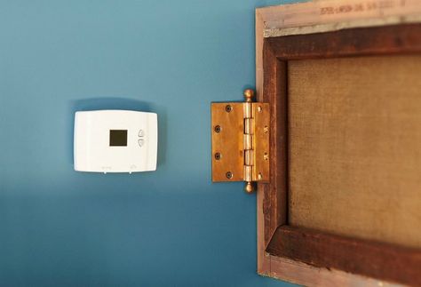 Try one DIYer's simple, state-of-the-art solution for hiding a thermostat and any other bulky wall-mounted consoles. Hide Thermostat, Hiding Ugly, Clever Organizer, Wall Safe, Diy Home Repair, Home Organization Hacks, Water Stains, Love Home, Home Repair