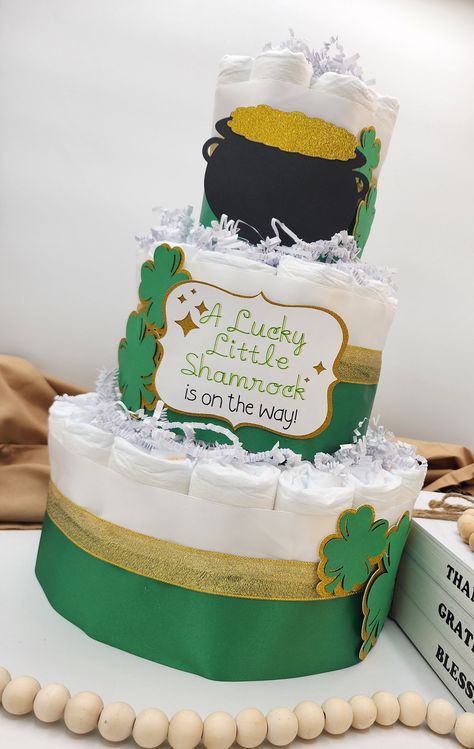 Excited to share the latest addition to my #etsy shop: 3 Tier Diaper Cake - A Lucky Little Shamrock is on the Way! Theme - Green and Gold Clovers Pot of Gold Baby Shower Centerpiece https://etsy.me/3mGu3kl #potofgold #babyshower #greengold #diapercake #stpatricksday Lucky Charms Baby Shower Theme, Shamrock Baby Shower Ideas, Lucky Charm Baby Shower Ideas, March Baby Shower, 1 Tier Cake, St Patricks Baby, Theme Green, March Baby, Gold Baby Shower