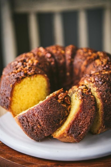 A perfect celebratory dessert for the holidays! This easy whiskey cake recipe starts with a box of cake mix for a moist, flavorful, and quick yellow Bundt cake that's topped with walnuts and soaked with a rich, butter-whiskey glaze. The old-fashioned treat has been a favorite for generations! Yellow Bundt Cake, Whiskey Cake Recipe, Whiskey Glaze, Old Fashioned Whiskey, Whiskey Cake, The Seasoned Mom, Whiskey Tasting, Instant Pudding Mix, Warm Cake