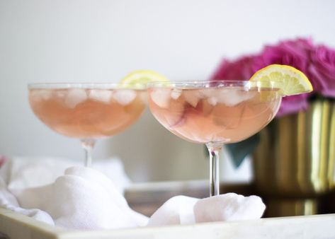 THE PINK FRENCH 75 COCKTAIL RECIPE | The Beauty Blotter Rose Cocktail Recipes, French 75 Cocktail Recipes, Liqueur Cocktails, French 75 Cocktail, Rose Cocktail, French 75, Summer Drink Recipes, Fruity Cocktails, Pink French