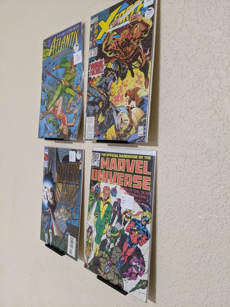 "Display your most prized comics with these floating shelf units Easy installation and very sturdy! Choose between Screw mounted and tape mounted! NEW Added optionality for command style. these are an improvement over the regular tape mounting variety as they easily remove damage free (just pull the tab) After removal you can purchase \" large command strip refill\" to replace the wall stick layer. slim version is great for holding bare comics upright wide version gives more space for comics in