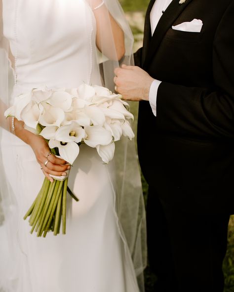 A calla lilly bouquet 🥹 period. Ranunculus And Calla Lily Bouquet, White Orchid And Calla Lily Bouquet, Long Stem Calla Lily Bouquet, Bridal Bouquet Calla Lily, Calla Lilly Bouquets Wedding, Lilly Bouquet Wedding, White Calla Lily Wedding Bouquet, Baby's Breath Bridal Bouquet, Calla Lily Wedding Invitations