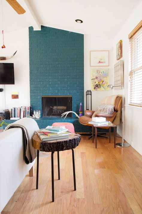 now i just need to steal the old tree trunk pieces from my neighbor's yard and i can make a sweet side table. Teal accent wall #turquoise #teal Painted Brick Walls, Painted Brick Fireplace, Painted Brick Fireplaces, Paint Fireplace, Smart Tiles, Austin Homes, Modern Farmhouse Living Room, Fireplace Makeover, Painted Brick