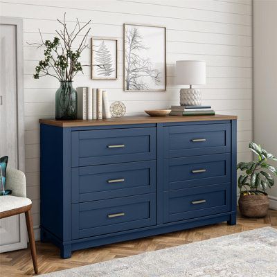 This 6-drawer dresser completes your bedroom with a sleek aesthetic and glam accents. It's crafted from engineered wood with a finish on the body and a natural panel on top. The six spacious drawers provide ample room for tucking away your clothing and linens, and the drawer fronts feature picture panel molding. They're accented with minimalist brass metal drawer pulls in a bar shape. | Lark Manor™ Almiro 6 Drawer 54.13" W Double Dresser 32.05 H x 54.13 W x 15.75 D in blue / brown / grayWood in Dresser Remodel, Navy Dresser, Blue Dresser, Wide Dresser, Laminated Mdf, Dresser Storage, Bedroom Décor, Painted Dresser, Double Dresser