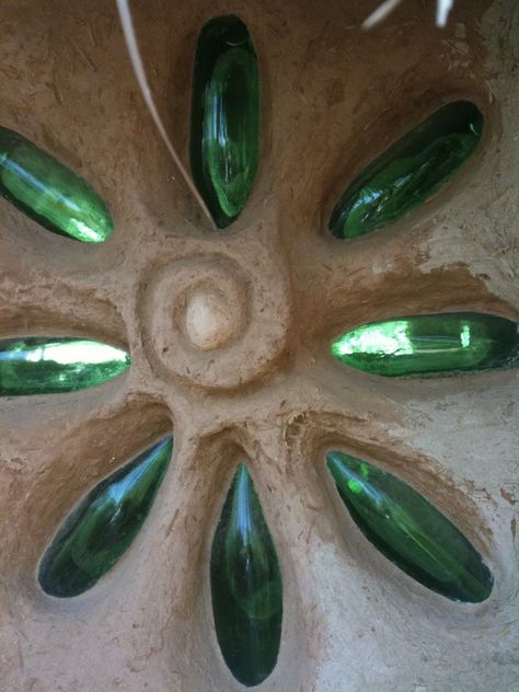 These glass bottles are in a cob wall... could we do this in the bathroom walls? Not sure how that would translate with the depth of earthbags, but this would be a great way to add pretty light to our windowless loos! Cob Wall, Eco Construction, Cob Building, Casa Hobbit, Earth Bag Homes, Straw Bale House, Earthship Home, Mud House, Natural Homes