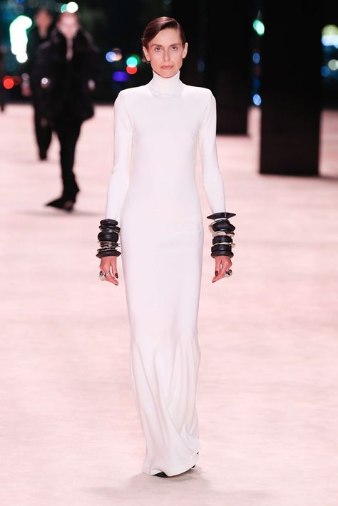 Saint Laurent RTW Fall 2022 [PHOTOS] – WWD Saint Laurent Fall 2022, Fall 2022, White Formal Dress, Fashion News, The Collection, High Neck Dress, Saint Laurent, White Dress, Formal Dresses