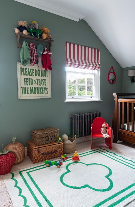 A gender neutral green nursery, with a subtle circus theme. Image rights: www.juliacurriephotography.com Fun Colorful Nursery Ideas, Vintage Circus Bedroom, Nursery Ideas Green Walls, Red Crib Nursery, Boyhood Nursery, Fun Boy Nursery, Circus Theme Nursery, Bold Wall Paint, Bold Nursery Ideas